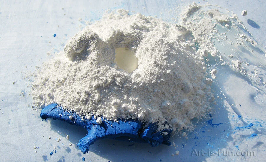 Mixing blue and white pigment to create a tint