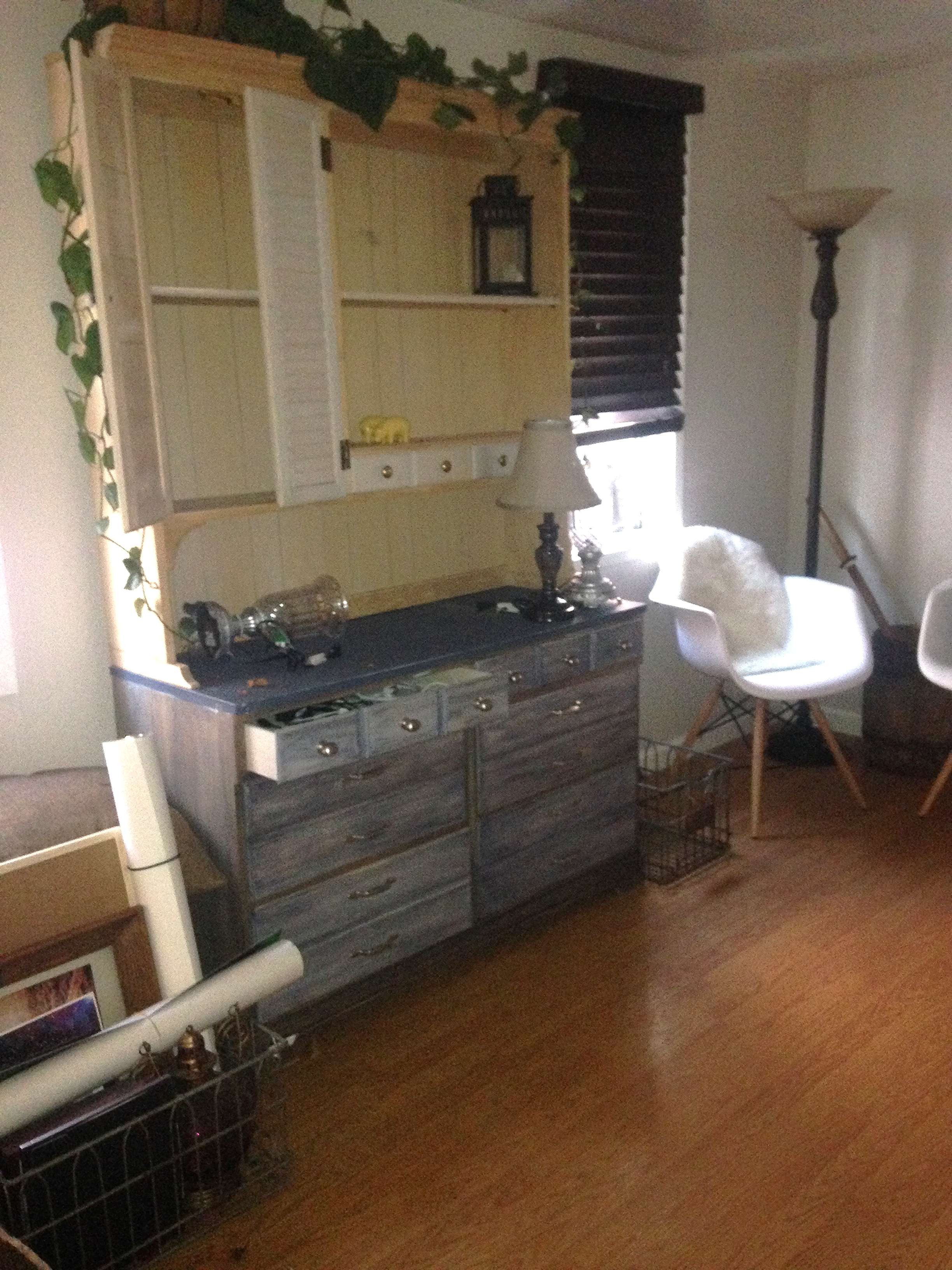 A very blurry picture of the used hutch we bought and a crate with lots of things loaded inside. They painted the bottom of the hutch but left the top unfinished. I'm thinking of painting just the cabinets and shutter above to match. What do you think? Will that look good? 