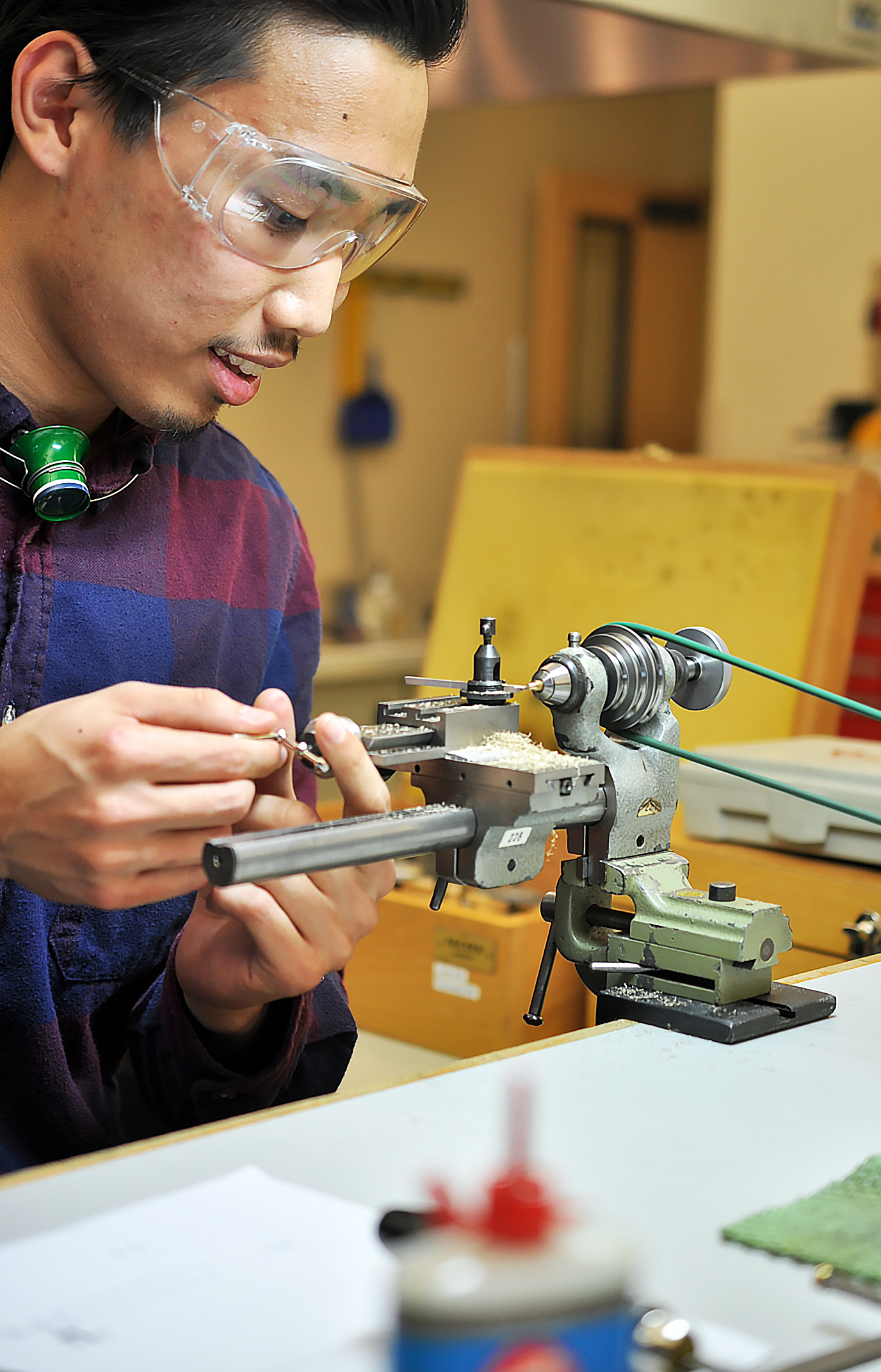 Max, a second year student, visits our side of the class to turn his handmade etachron tool on a lathe.
