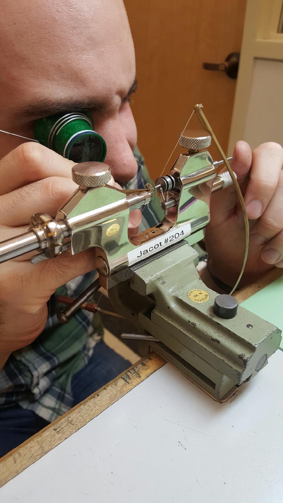 Getting the 4th wheel pivots properly seated. Photo by: A. Diaz