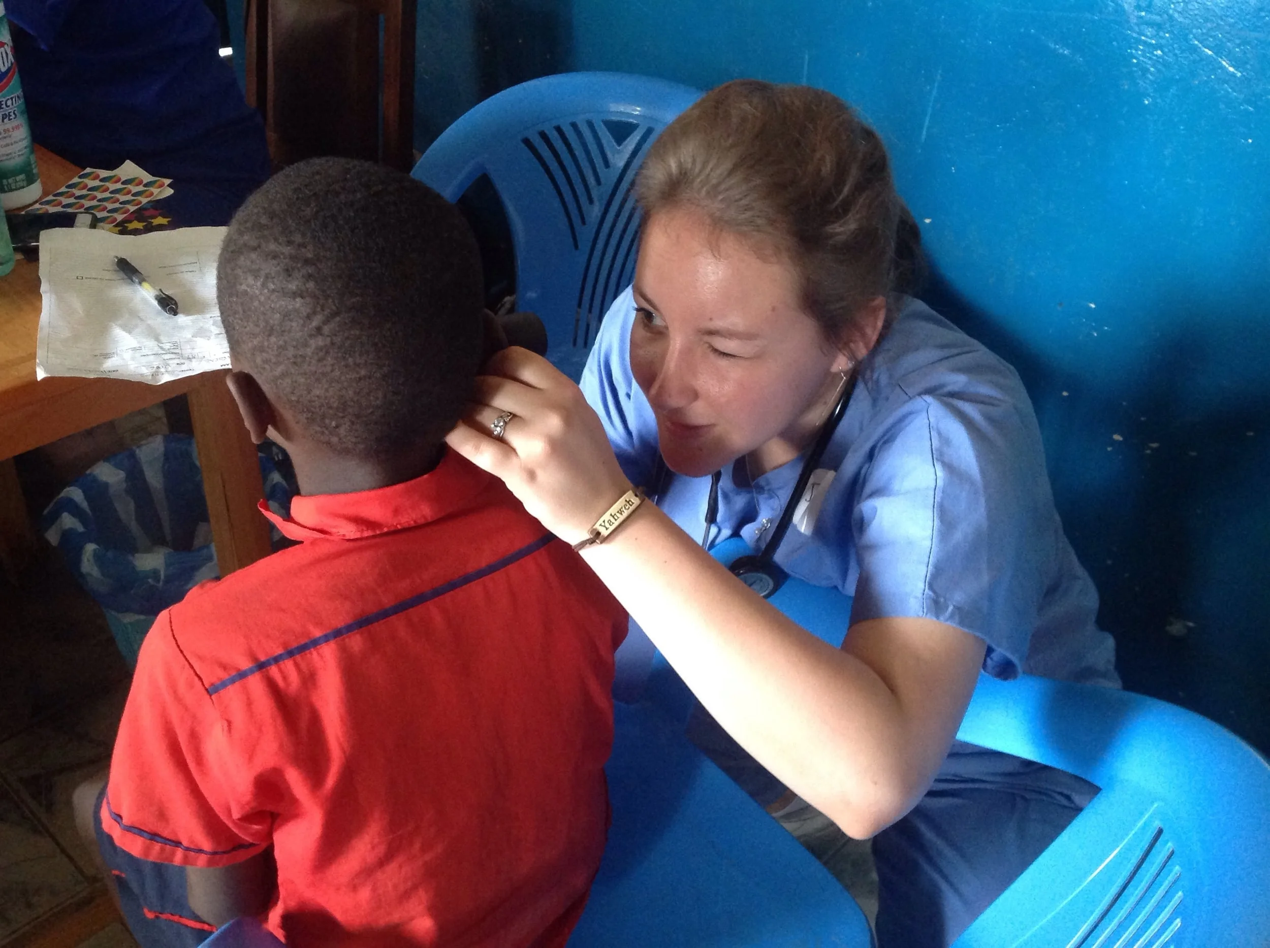 Jodie doing ear exam