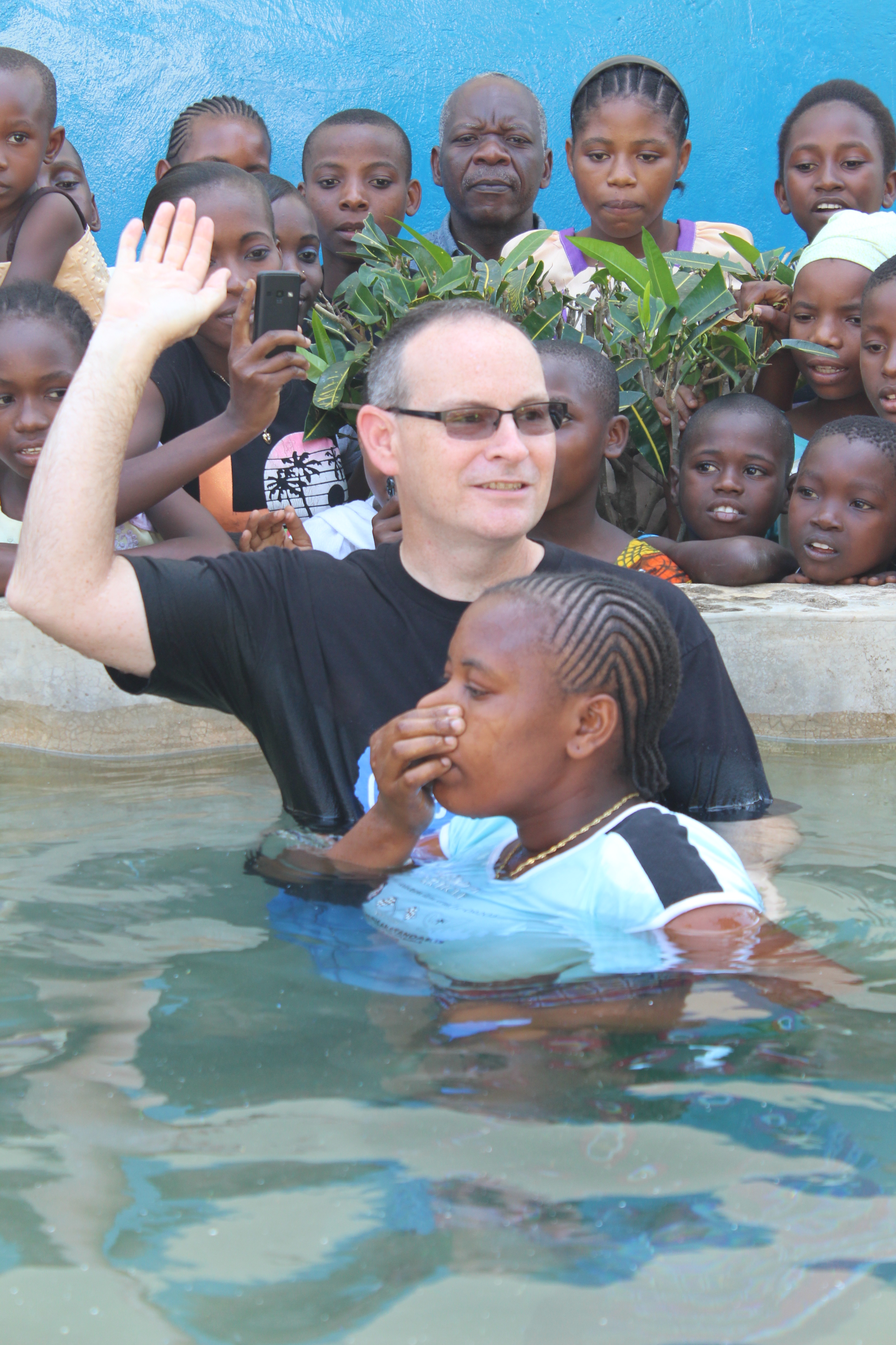 Bobby baptizing during a church service.
