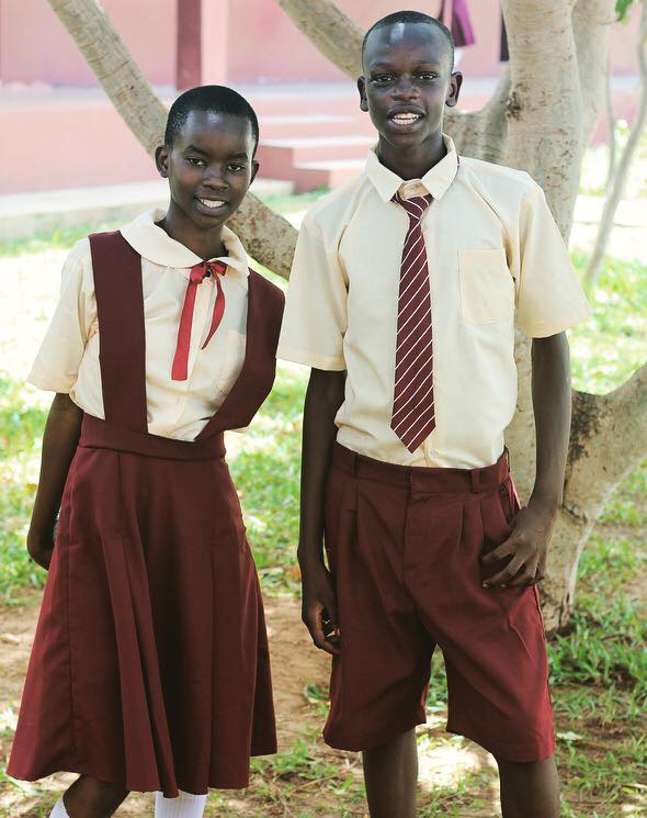 Example of uniforms for older girls and boys. I heard that the boys had a lot of fun learning how to tie a tie!