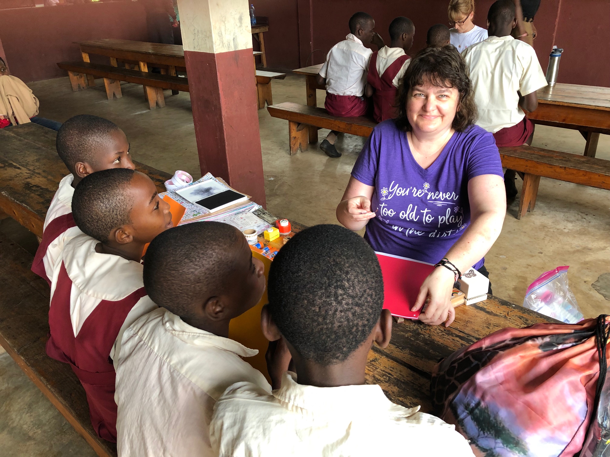 Jenni is teaching her group how to do the craft at their center.