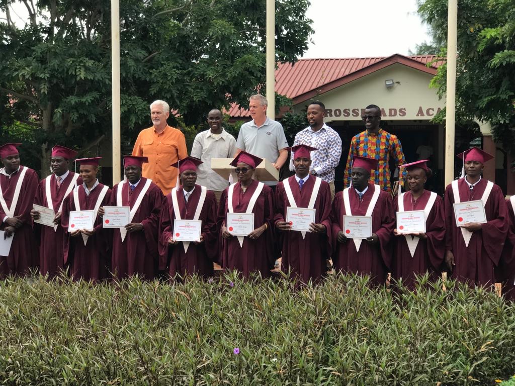 Pastor Mark, the teachers and the graduates.