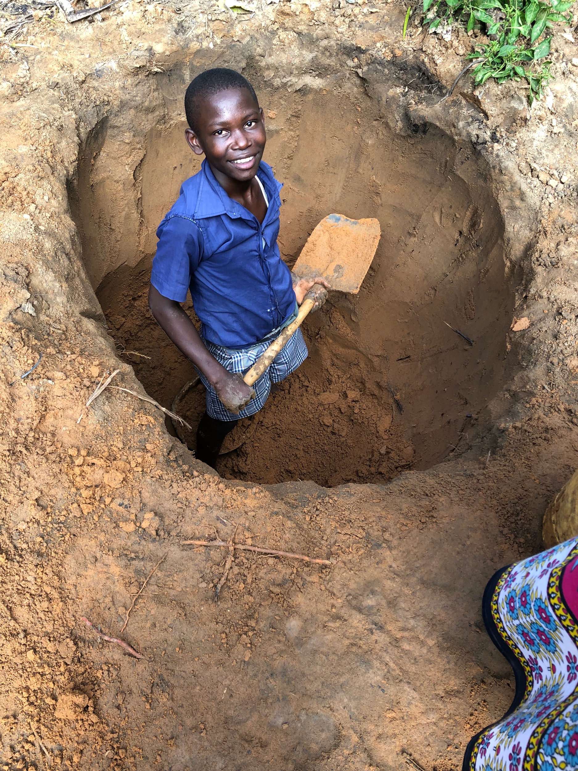 The hole left behind after the dirt was hauled away to be turned into mud. They will use the hole as a compost pile or pit latrine.