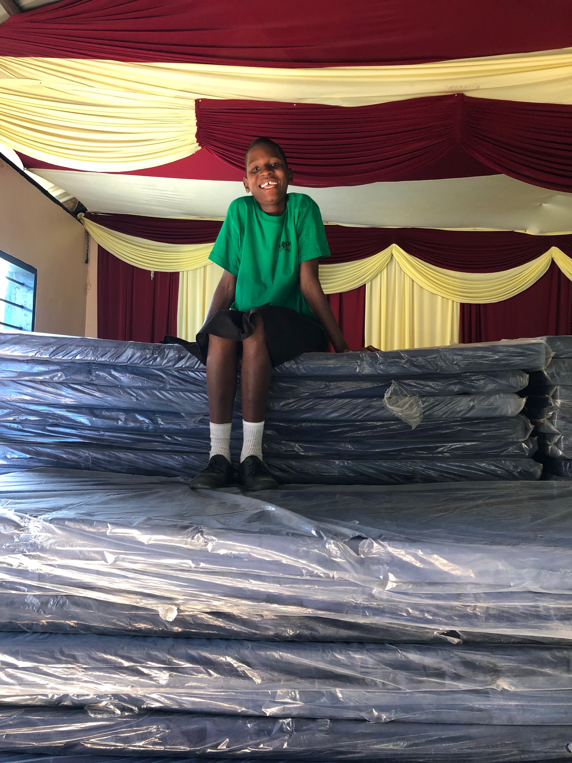 Over 100 mattresses given out to families today. This young lady received a mattress in January and couldn't stop talking to us about the difference it has made in her life!