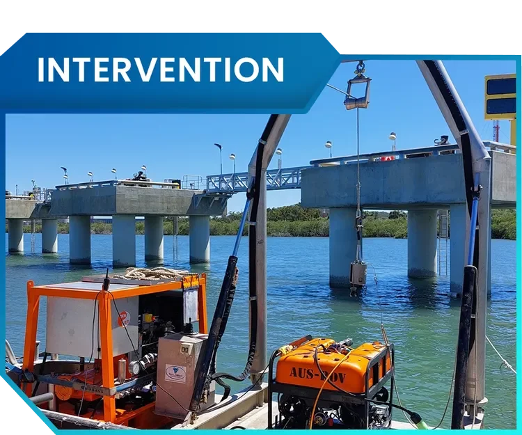 Underwater bridge inspection equipment on a boat, with a bridge over water in the background.