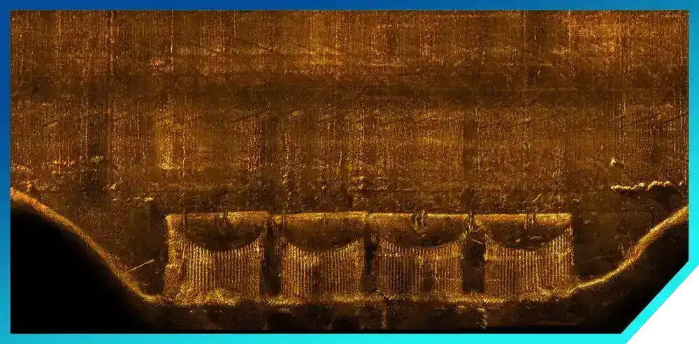 Close-up of a metal surface with a pattern that resembles a mirror's back side, showing reflections and scratches.