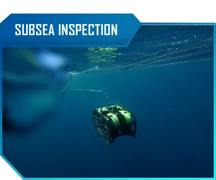Underwater remotely operated vehicle during a submarine inspection, with water and bubbles surrounding it.