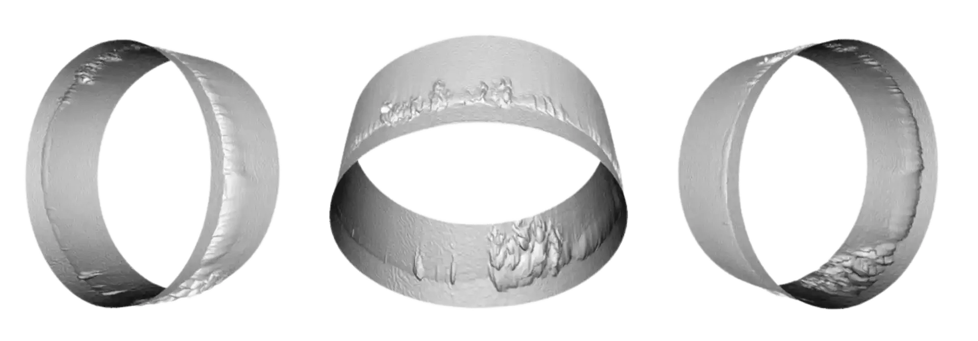 Three metallic rings with rough, textured surfaces arranged against a white background.