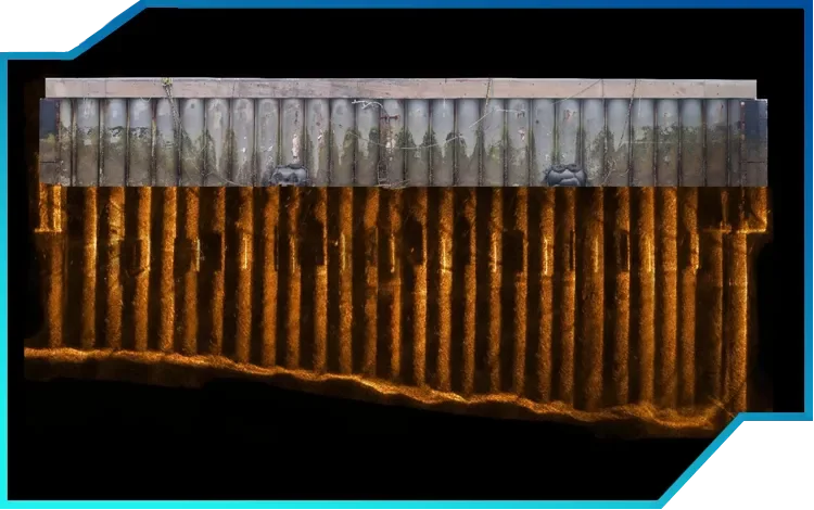 Steel pile wall surveyed using photogrammetry above water and multibeam sonar below, creating a seamless surface-to-seabed dataset.