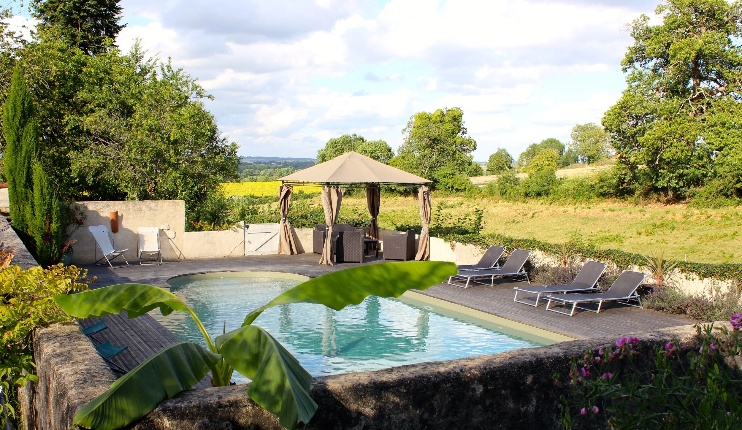 10 m by 5 m in-ground pool with olive green liner and decking terrace.