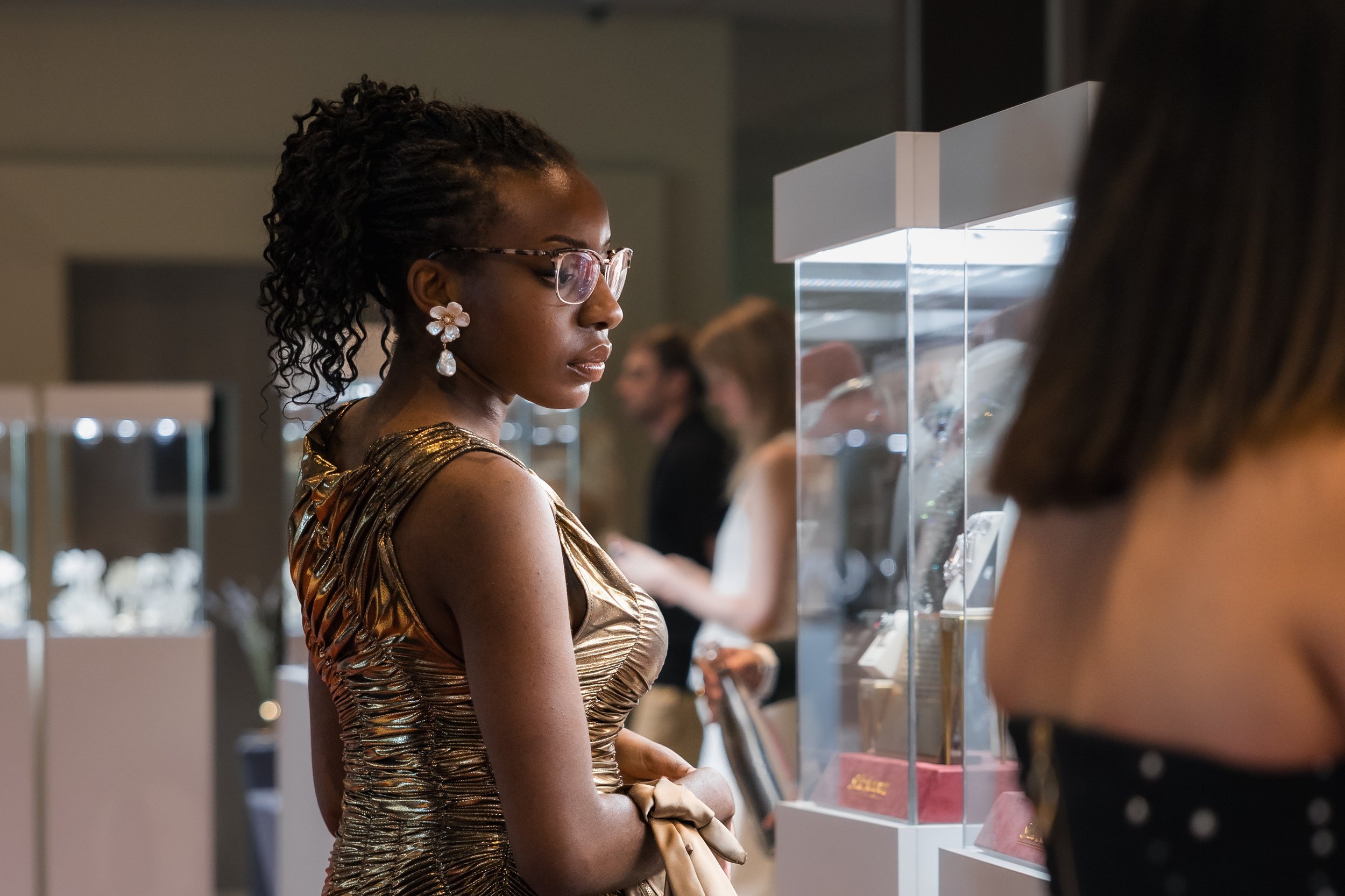Guests looking at jewellery showcases.jpg