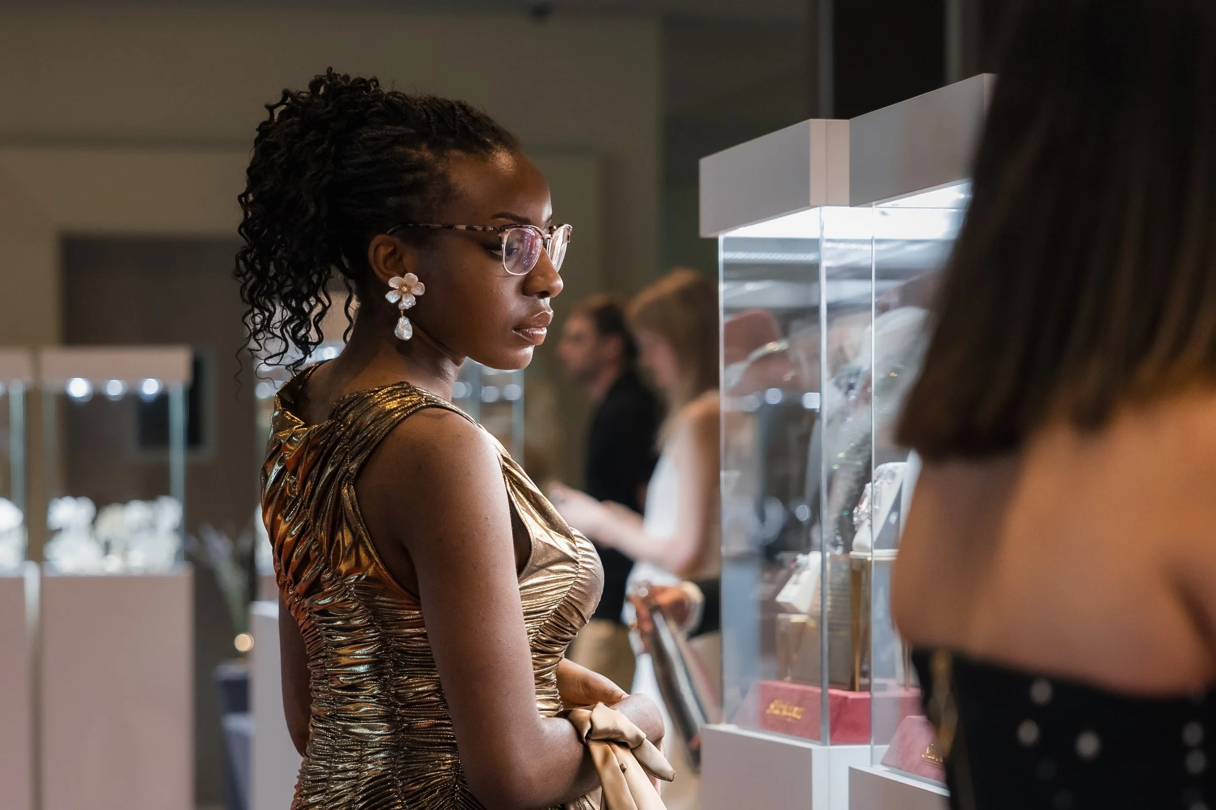 Guests looking at jewellery showcases.jpg