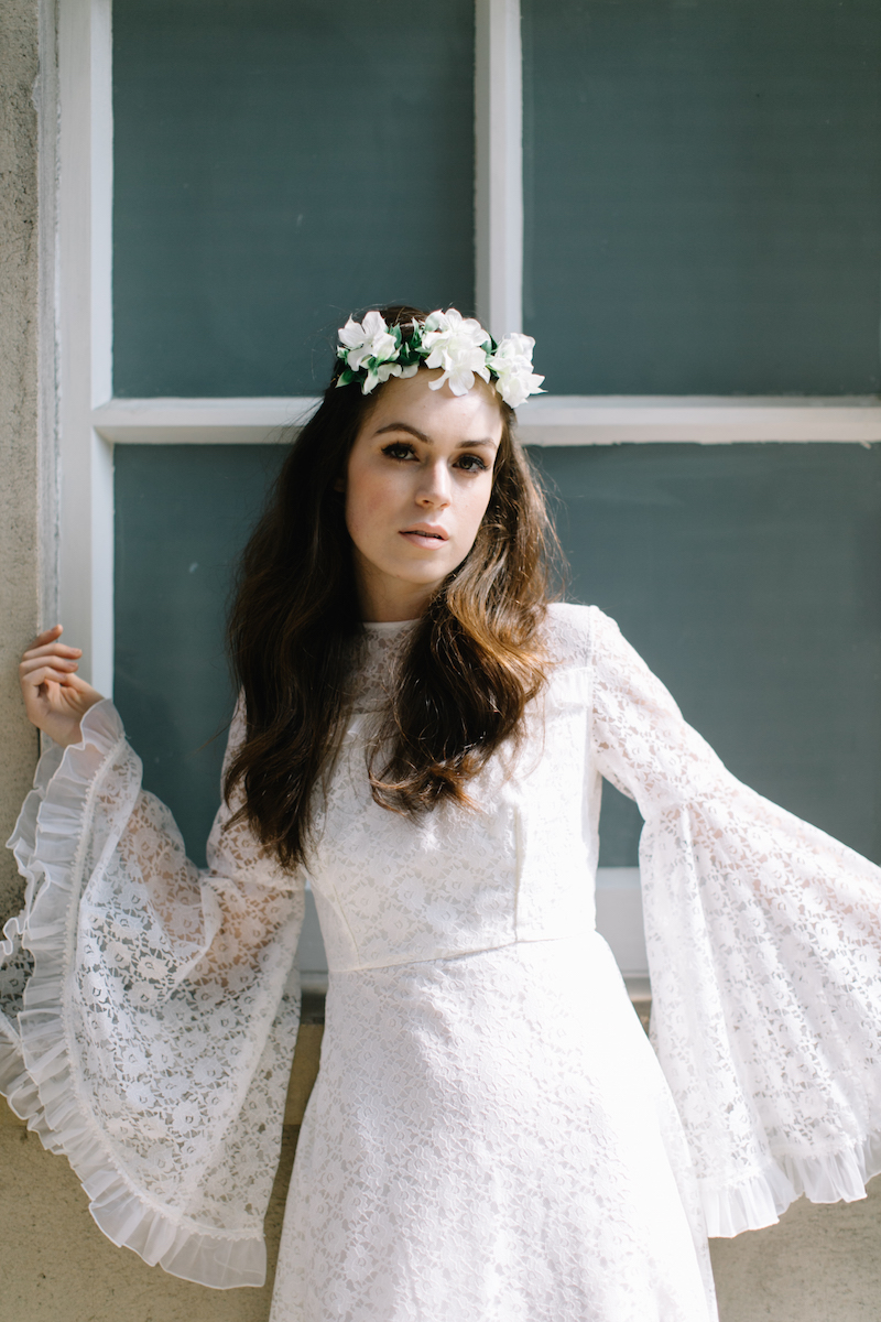 bell sleeved wedding dress and floral crown by Archive 12