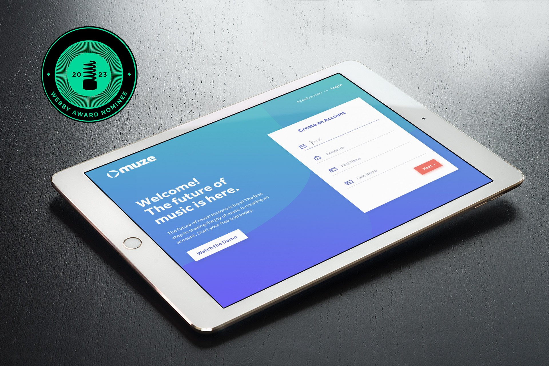  Muze app shown in an ipad laying on a desk with a logo for Webby Award Nominee.  