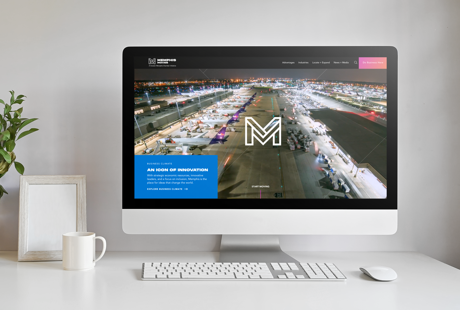  The Memphis Moves website homepage shown on a desktop computer with a coffee cup, mouse and keyboard 