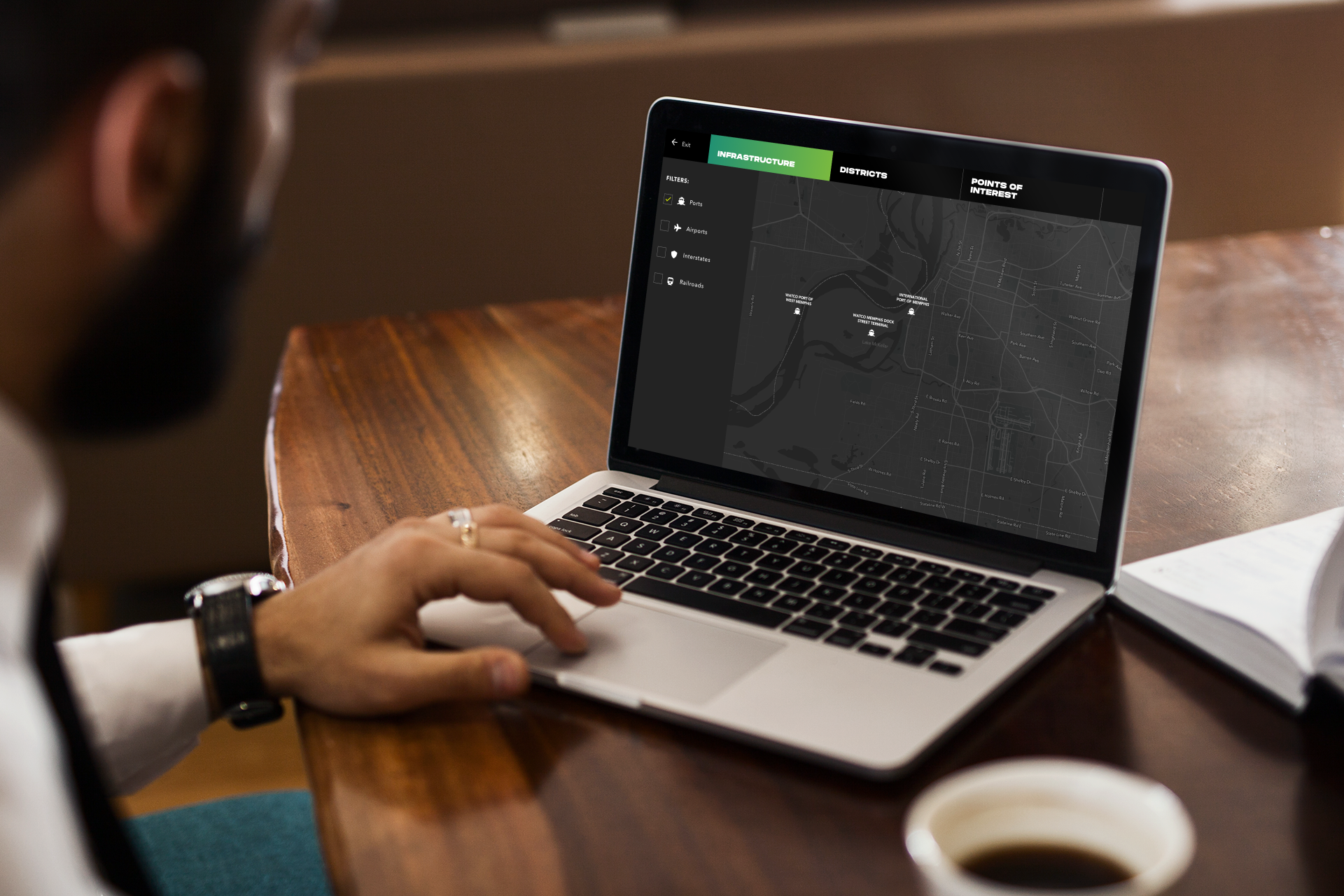  Businessman using the interactive map on the Memphis Moves website 