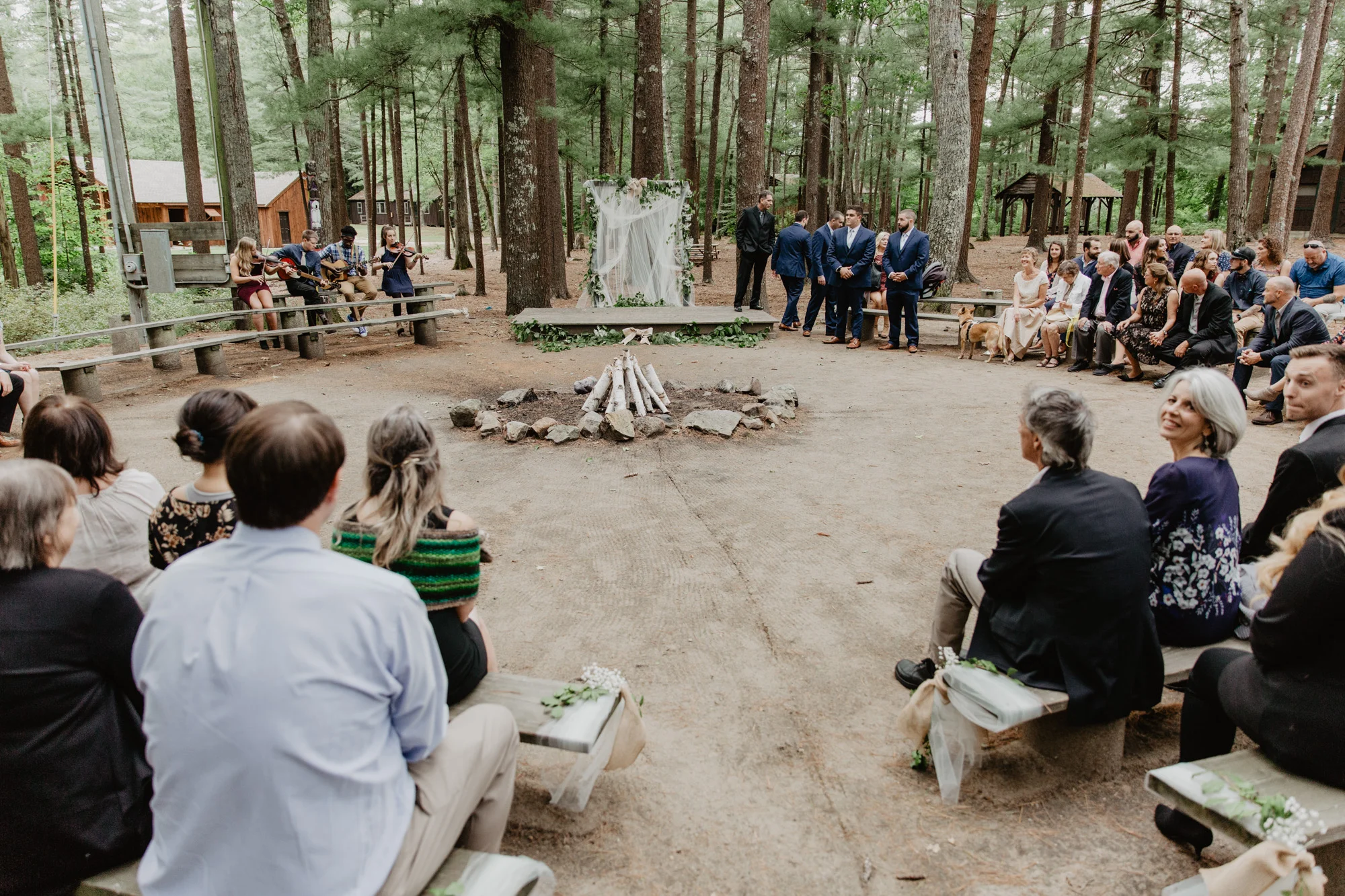 A wedding ceremony in the woods at Camp Wing summer camp