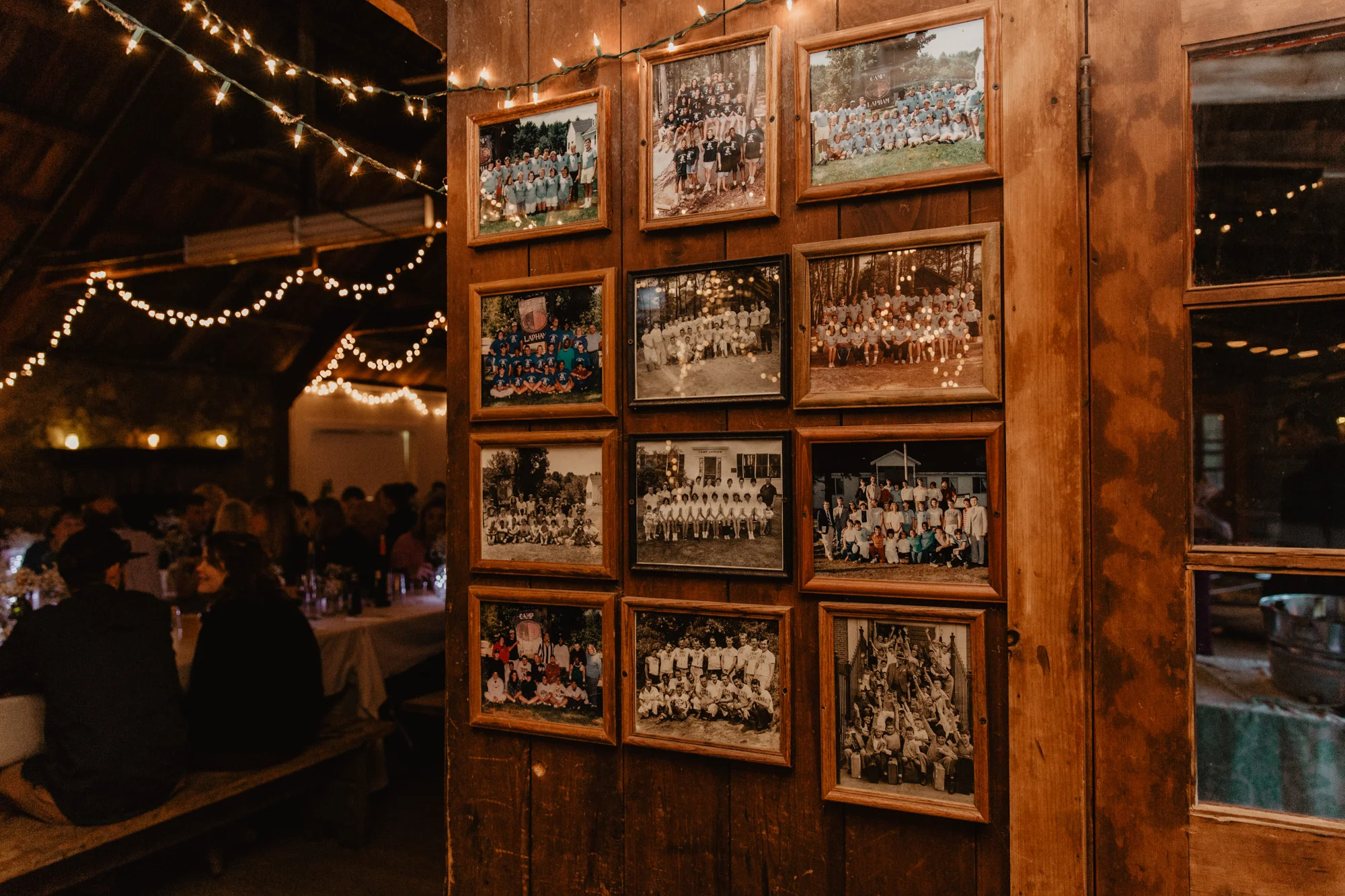 Old photos of campers hang in the Camp Wing mess hall