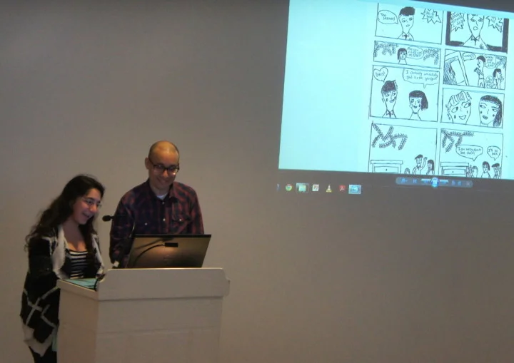 Me helping one of my students read the comic they made during my residency at Lincoln High School in 2015. Photo by Mel Wells, Literary Arts