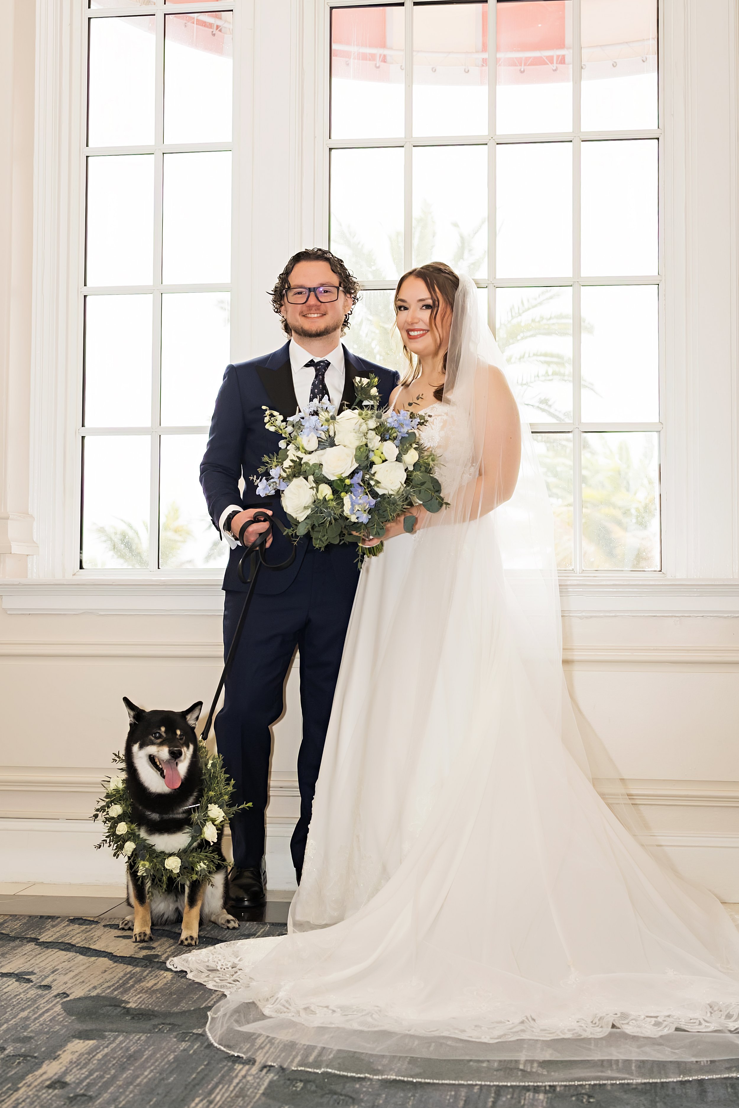 couple includes dog in wedding photos at the don cesar in st pete beach, fl