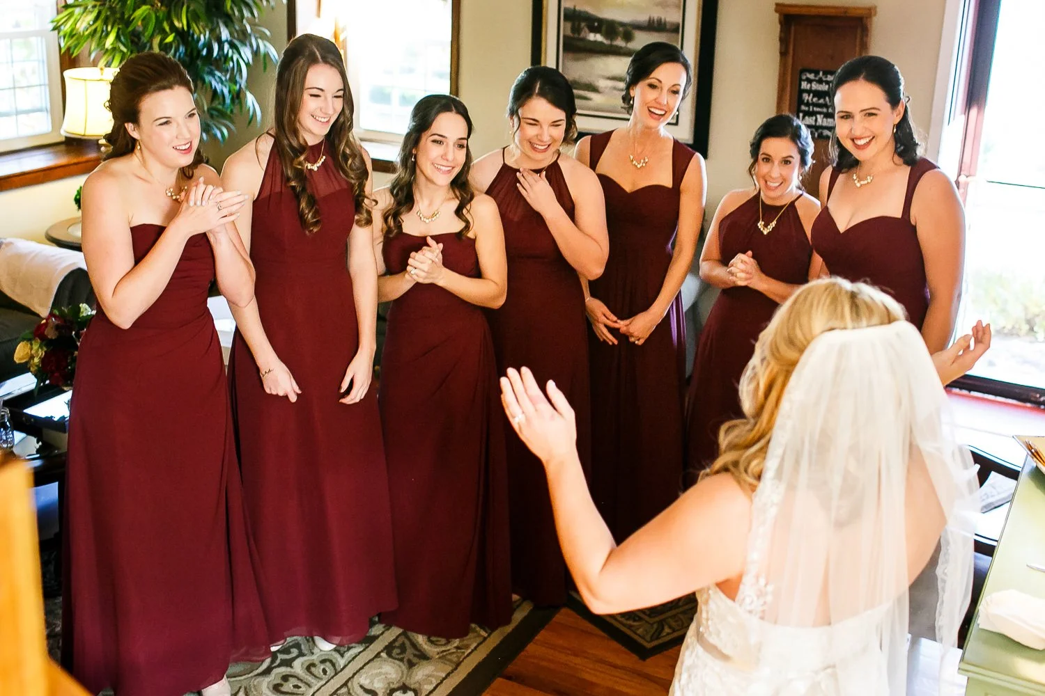 WED-Highlights-011-Bride-shows-her-bridesmaids-what-she-looks-like-in-her-wedding-dress-for-the-first-time.JPG
