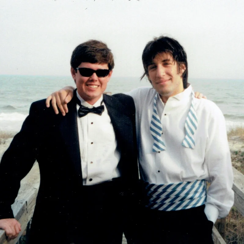 Frank Tortora | Groomsman | Raleigh Frank Tortora (aka The Savage) and I have been friends since we both joined Sigma Alpha Epsilon (SAE) in college at UNC-Chapel Hill. We have taught each other some valuable lessons over the years. When I was the chapter president, Frank was the vice-president. On occasions during that period where I thought we might have an incident at the fraternity house, I would think of Frank and how it would be important for him to learn the value of having a good VP once he was president, so I would disappear before any incidents occurred and leave him to deal with the mess. In turn, he used this same strategy during his term. In return, Frank taught me the finer points of interior design as our collective group would enjoy Robert Earl Keen and cases of PBR on Fridays and he would wallpaper his entire room at the house with PBR boxes. Your typical friendship for two North Carolina lawyers.