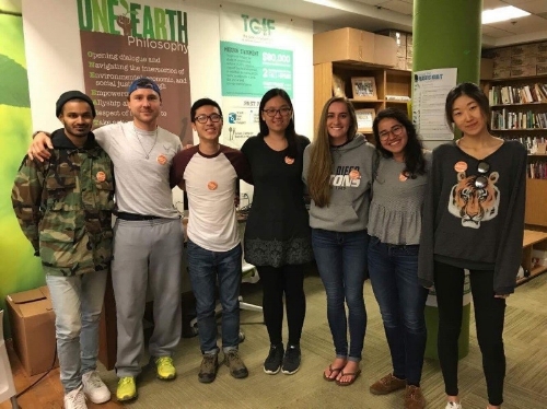 Caption: UC San Diego students wear orange buttons to show they are taking the #CalFreshChallenge.