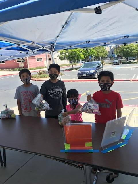 #6 Martinez Family Picking up Meals at Midland Elementary.png