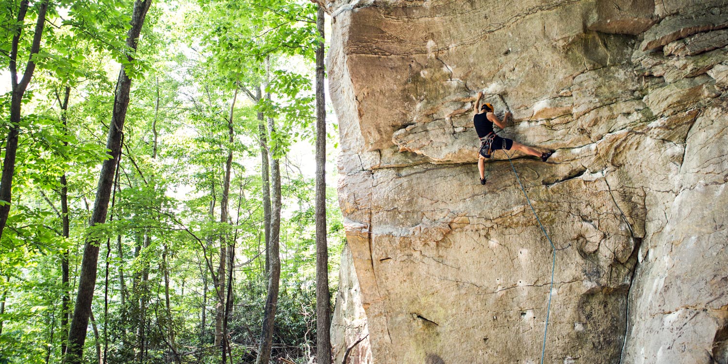 Student, Michael Yu working on his project, Narcissus, 5.12a