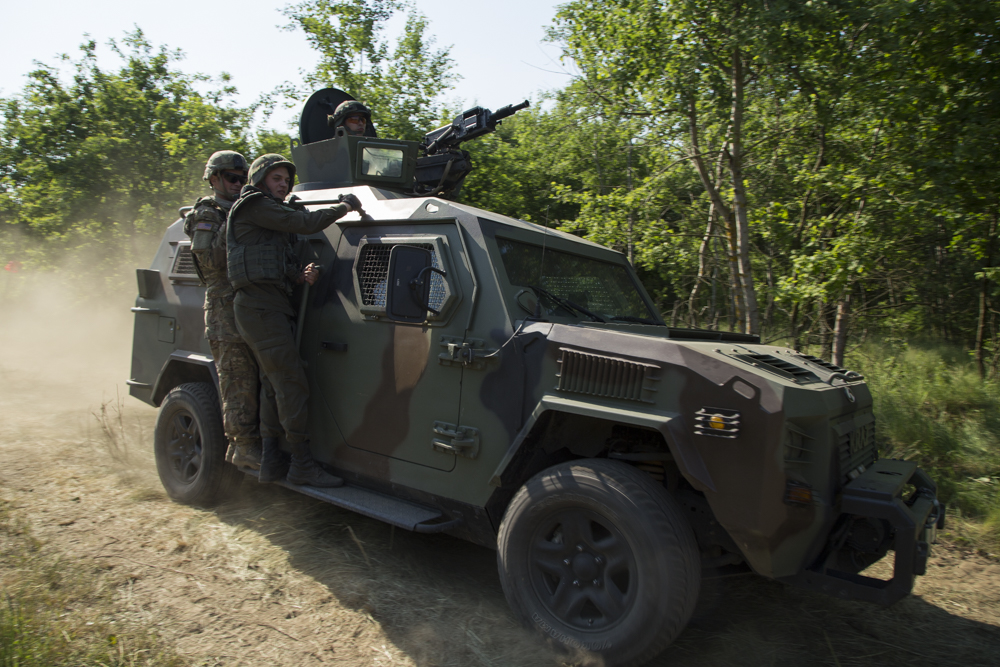  Ukrainian troops on a KrAZ truck during training exercises near the western city of Lviv, 2015.&nbsp; 