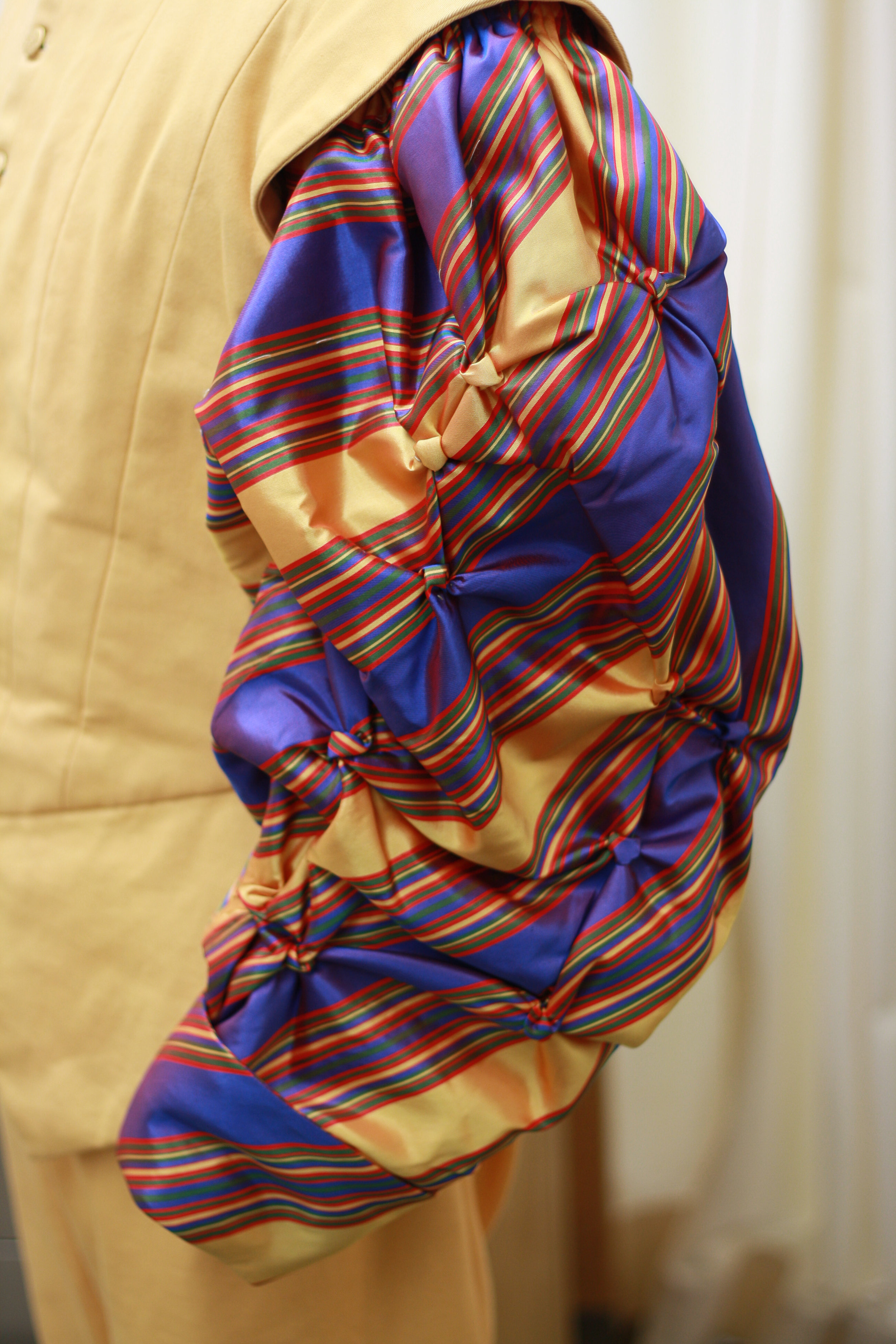   fabric manipulation- gathering stitches to create a textured button effect The Taming of the Shrew /The Old Globe/2010 design by Deirdre Clancy/draping by Randal Sumabat 