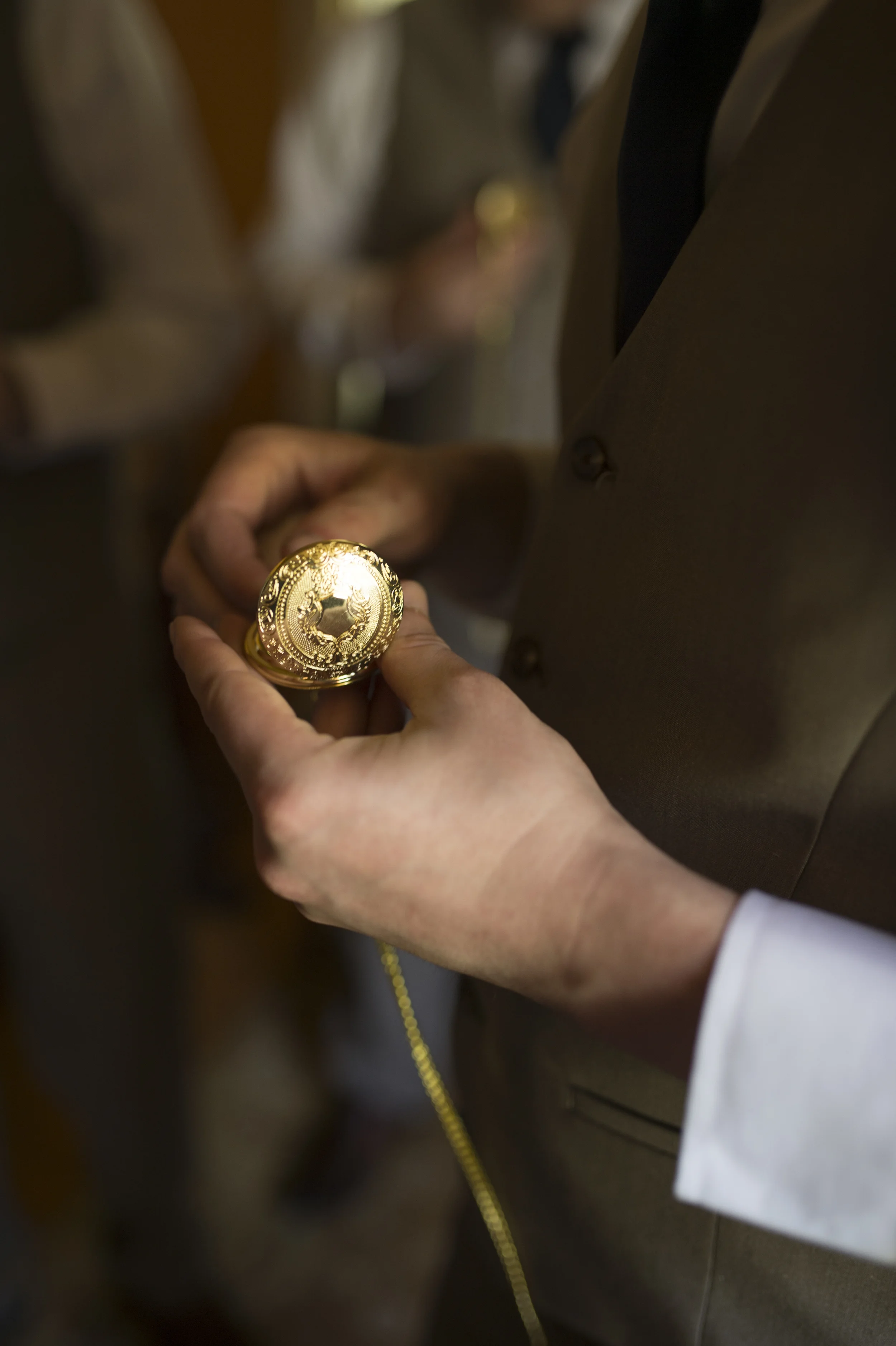Photocredit: Amberlee Christey This gorgeous gold pocket watch is the perfect accent for the groom who knows the importance of making it to the ceremony on time.