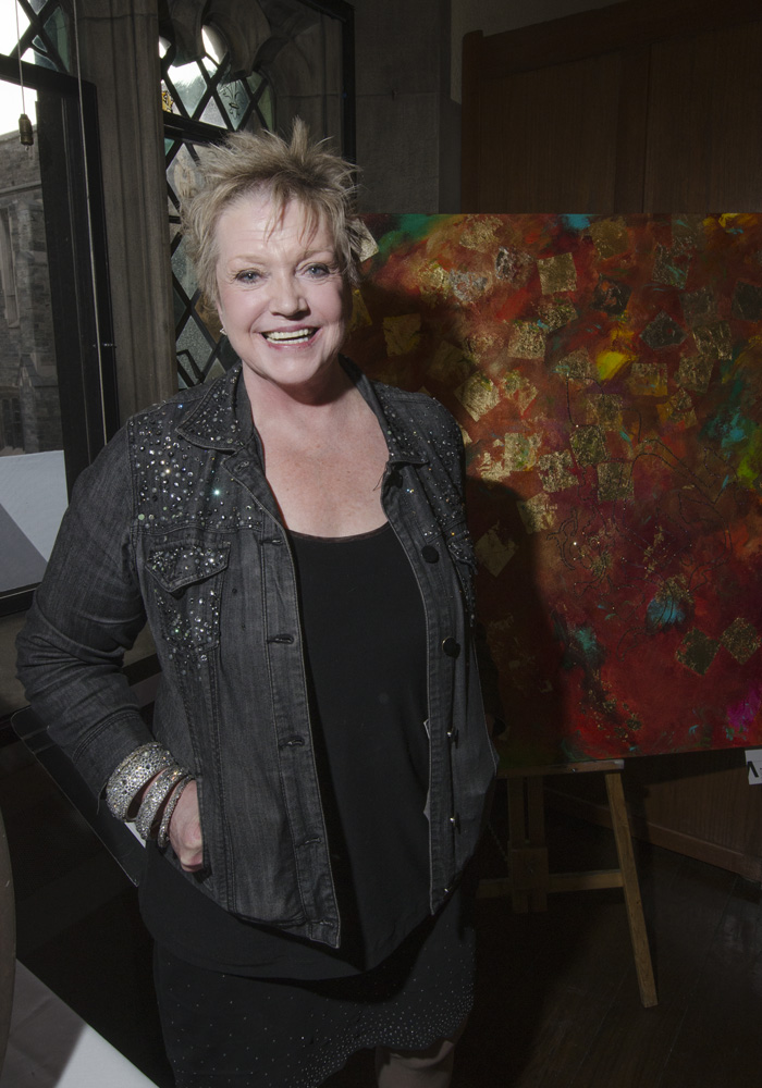 Barbara McGivern with one of her paintings