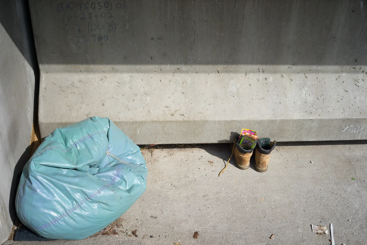 Boots under the bridge, Trinity River, March 7, 2014. Terry Evans