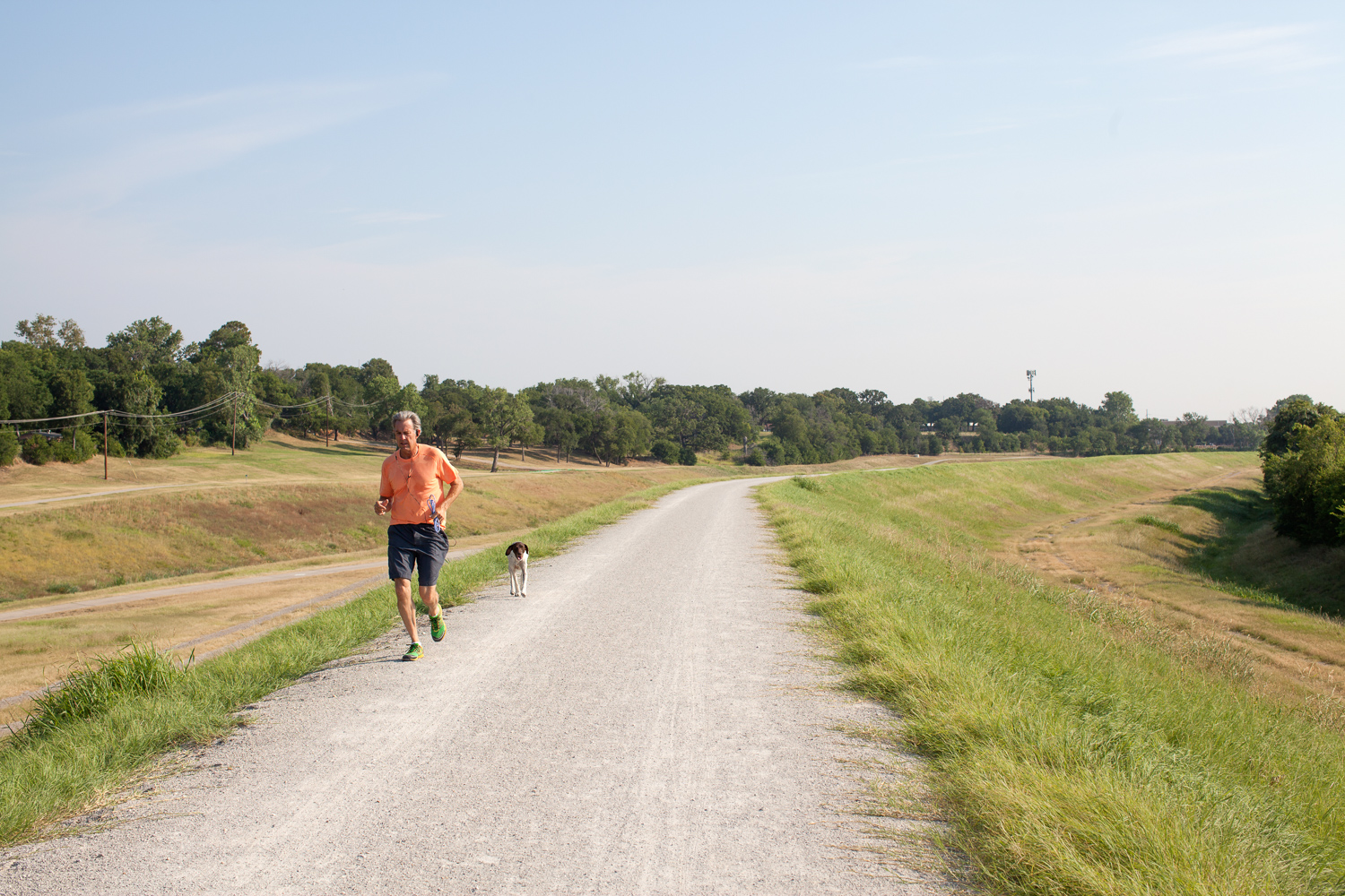 Runner with dog, Trinity River path, July 2013. Terry Evans