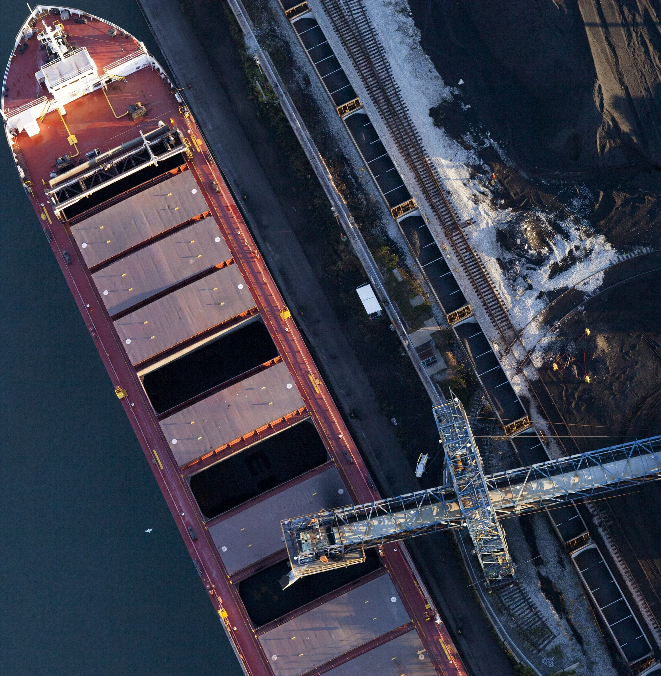 Loading petcoke onto a barge on Calumet River, 2015. Terry Evans