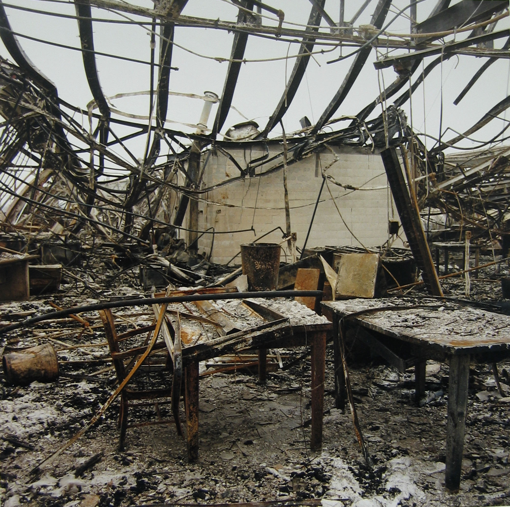 Abandoned main office building, with table and chair, destroyed in December 1995 by fire, August 1, 1996