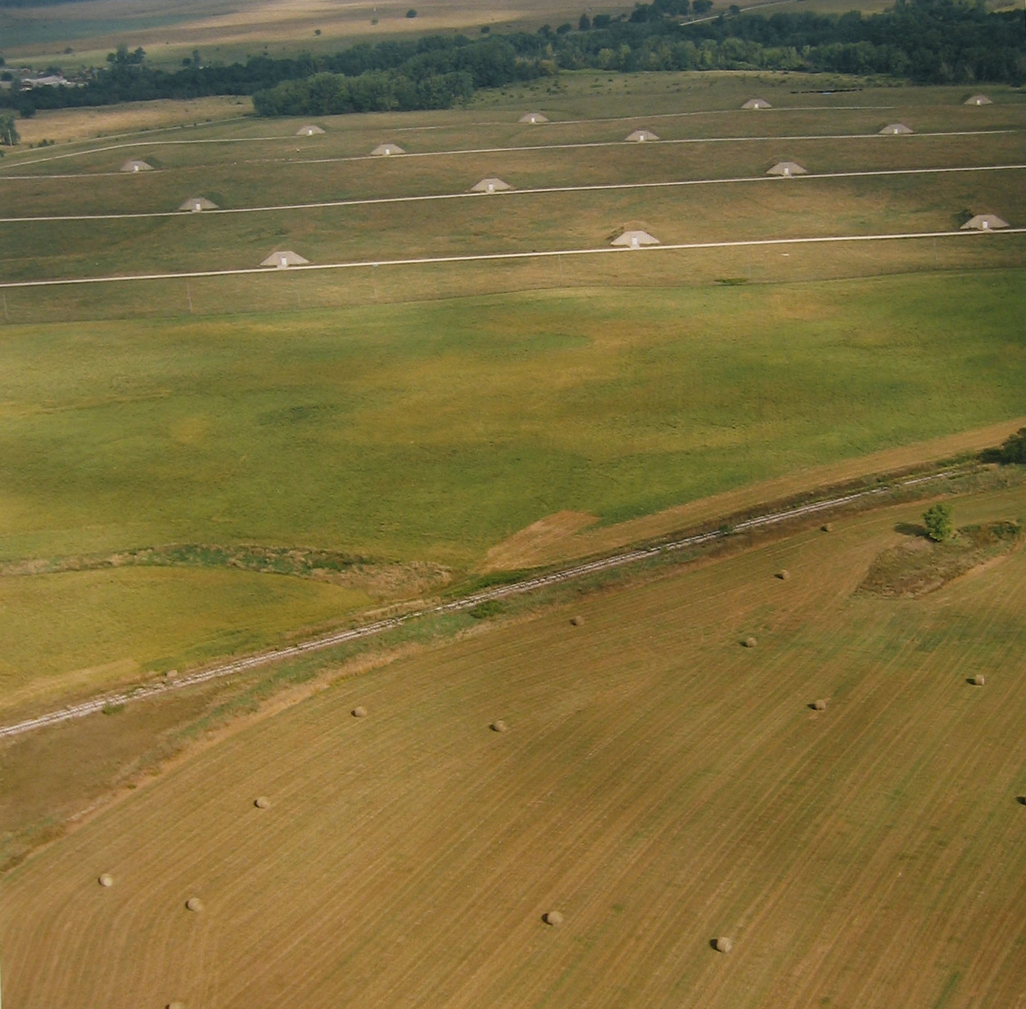 Ammunition storage bunkers and hay bales, September 9, 1995