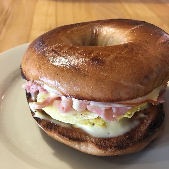 Want something delicious and different for breakfast? Try our Eggs Benedict breakfast sandwich on a French Toast bagel. You don&rsquo;t want to miss this savory sweet sandwich 😋 #thatswhatsforbreakfast #yum #frenchtoastbagel #eggsbenedict #eatlocal