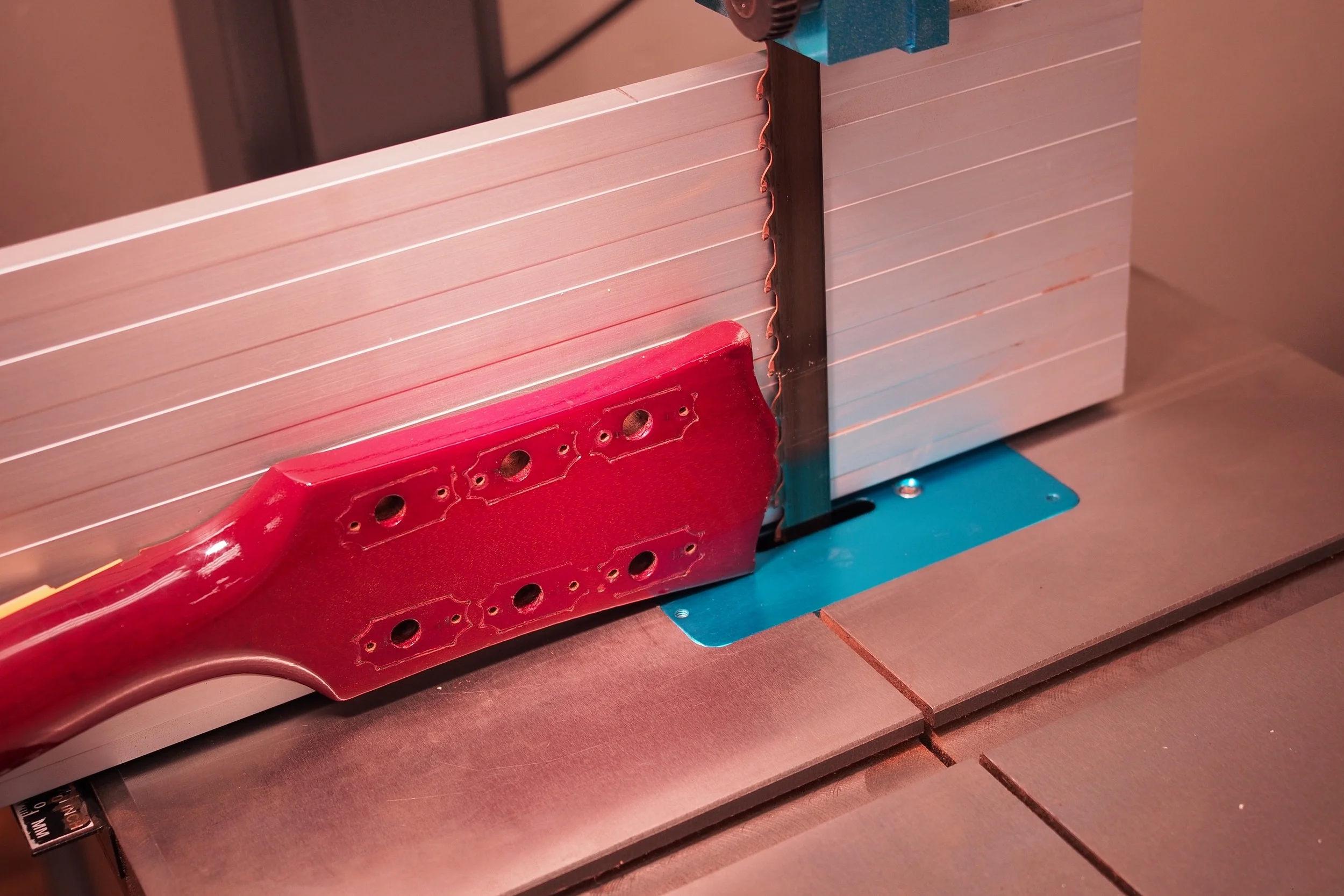 Don't attempt to adjust your monitor. You're seeing this correctly. Slicing the original peg head overlay, with the "Gibson" and Crown inlays in tact.