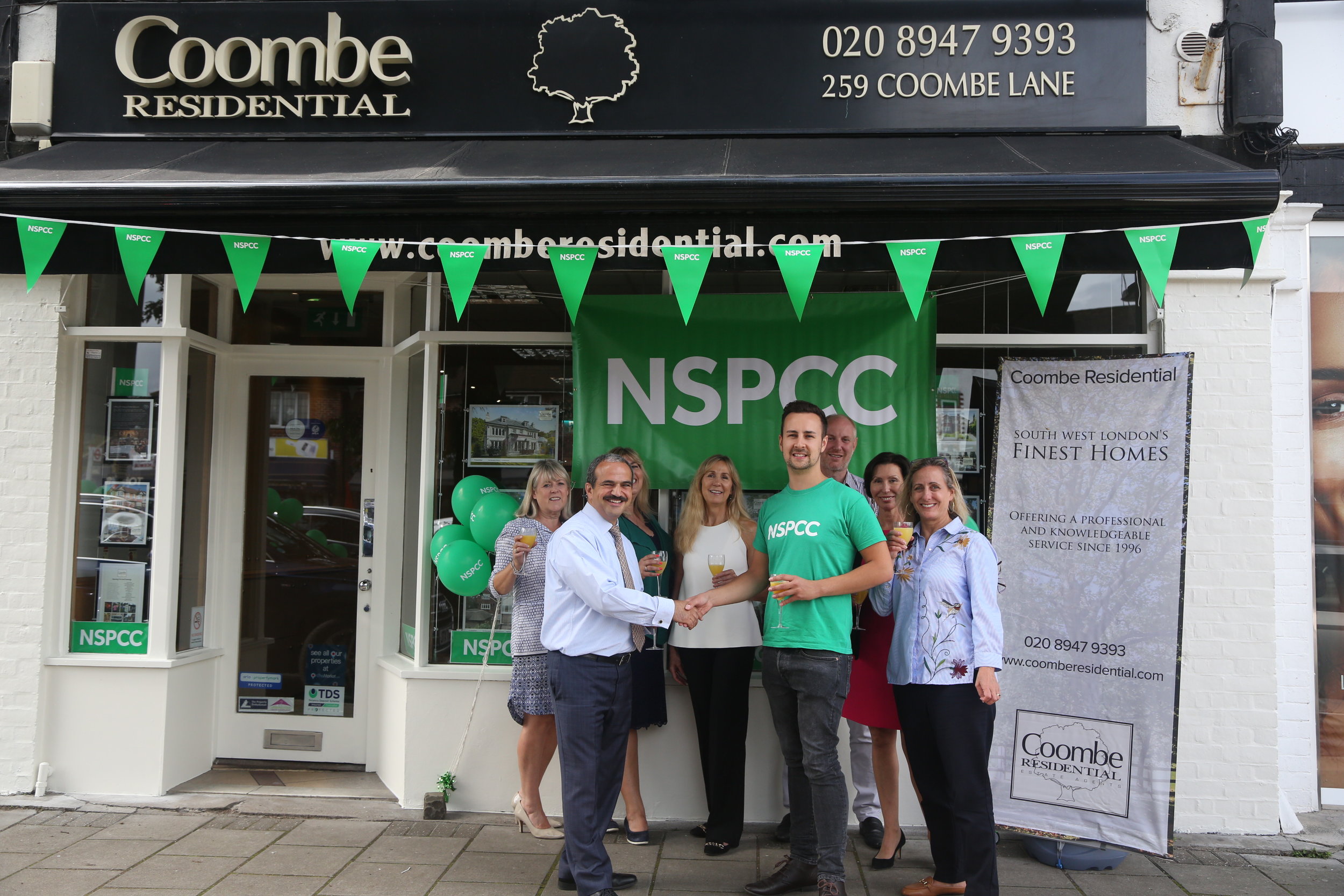 Photo 2-  The team and Lloyd Butcher outside the office at the launch.jpg