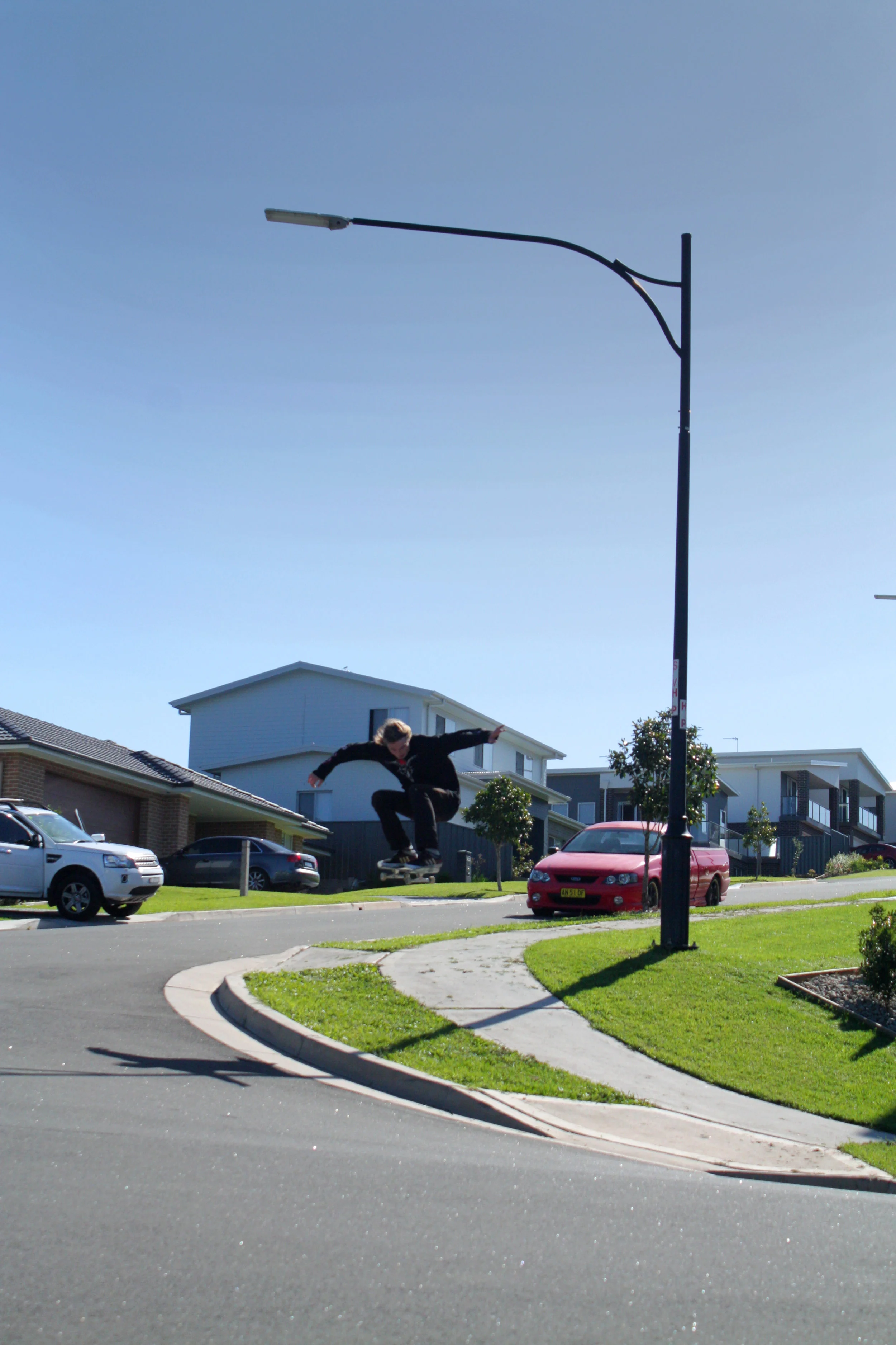  Ray Macken -Curb cut to curb cut Ollie. Photo Kane Horspool. 