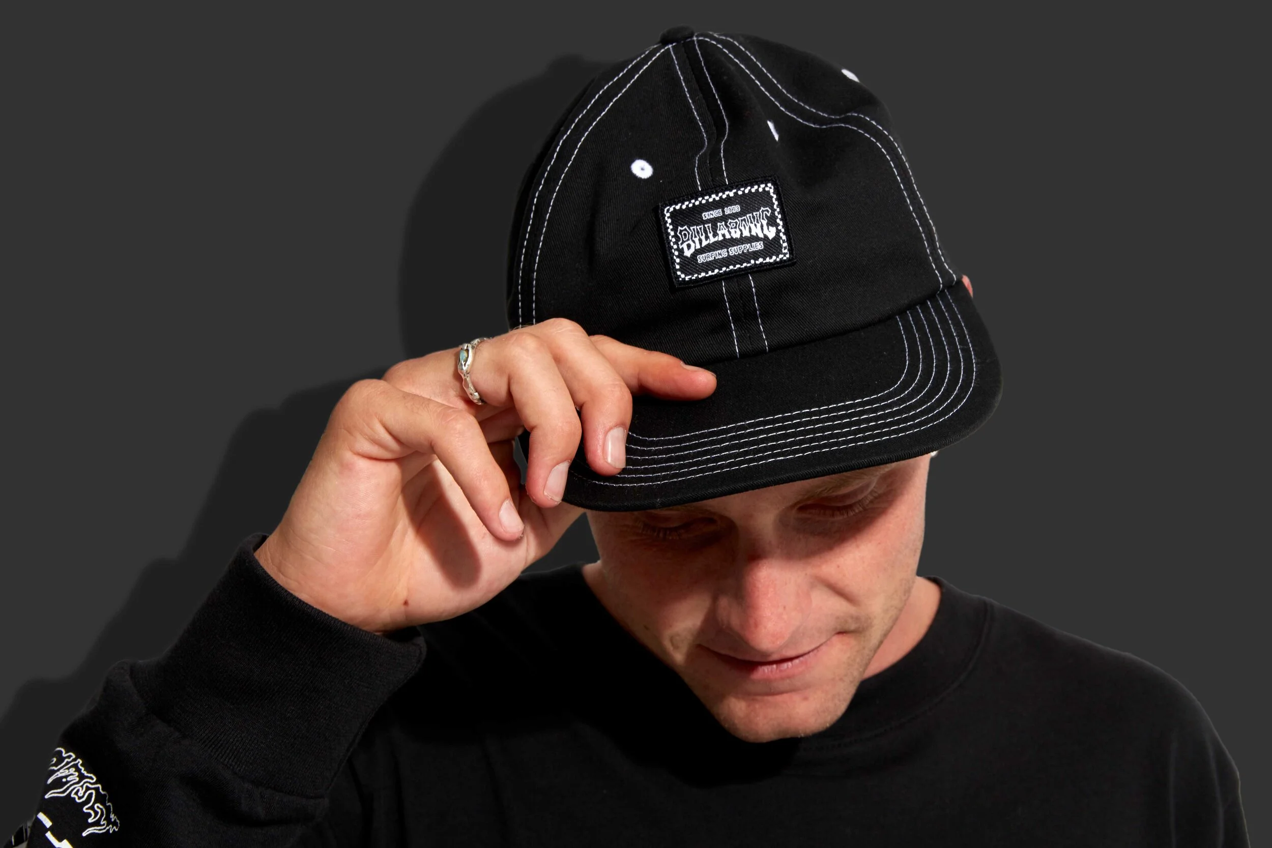 Strap back hat with contrast stitch detail &amp; woven patch branding