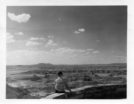 View from the terrace of Painted Desert Inn. The boy is Herbert Studdmonkey who grew up to become the first man to cross The Mojave Desert on his hands.