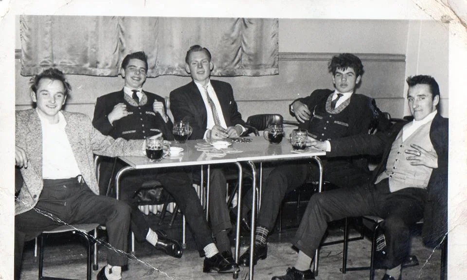 Timmy Bodine seated second from left, is clearly high. So are the rest of his pals, except Shawn Heacock on the far right. He got high once and tried to take his pants off over his head. He now drinks 13 Guinness each day. 