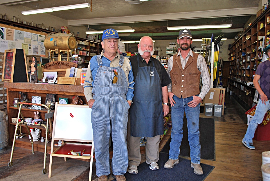 Right down the street from the Koosharem Cafe/video store, a few fellas pose for us at the Koosharem hardware/post office, which is right next door to Dr. Nutfloat's office/cattle feed store. 