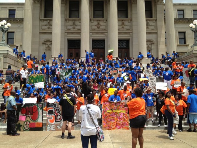 People awaiting The Bearded Man's announcement on the state capital steps in Jackson, Mississippi. Apparently someone thought the Blue Man Group was also speaking.